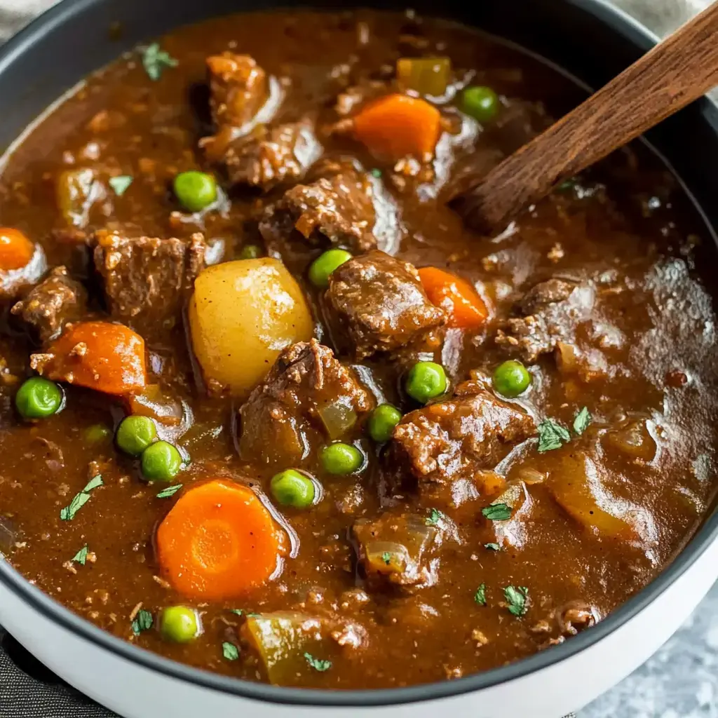 Chunky beef stew packed with carrots, potatoes and peas swimming in a rich, deep broth.