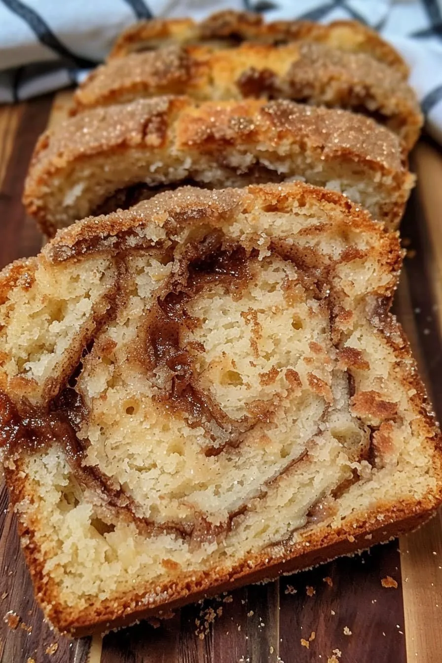 A cut slice with cinnamon swirls.
